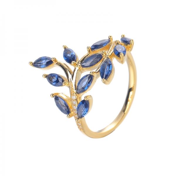 Criou o anel de casamento em forma de folha de oliva com gema de safira azul banhado a ouro amarelo 